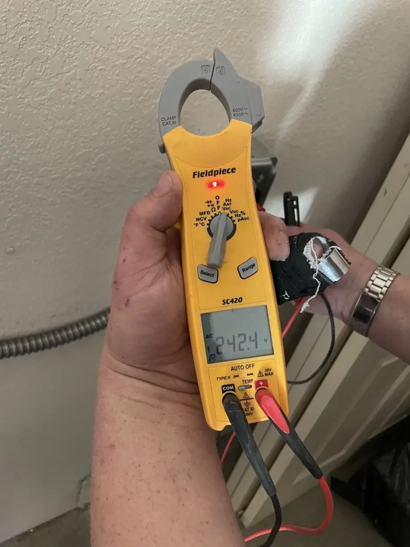 Voltage testing with clamp meter during Recessed Lighting Installation in Lincoln